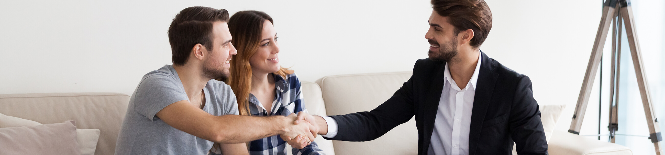 couple making deal with a realtor