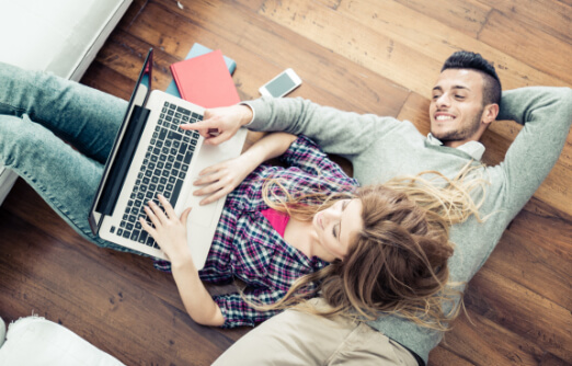 couple looking at a laptop screen