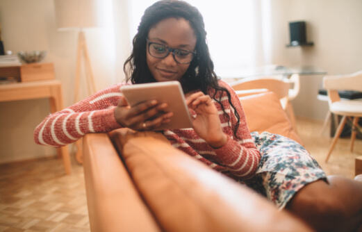 woman looking at a tablet device